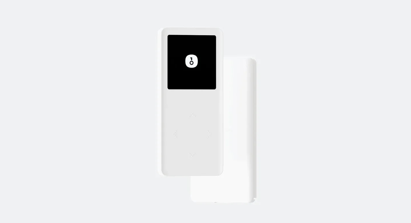 A compact white device with a rectangular form, featuring a small black screen displaying a white lock icon. The OneKey Mini Offline Crypto Wallet by HeadphoneHeat appears sleek and minimalistic against a plain white background, with the added convenience of USB Type-C connectivity.