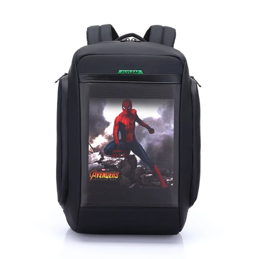 The Flashback backpack with HD Display by HeadphoneHeat is crafted from durable polyester and features a sleek black design. It boasts a large front compartment adorned with Spider-Man in his signature suit, with "Avengers" inscribed below the image. The backpack offers two padded shoulder straps, a top handle, multiple interior compartments, and the brand name "HeadphoneHeat" prominently displayed on the top front.