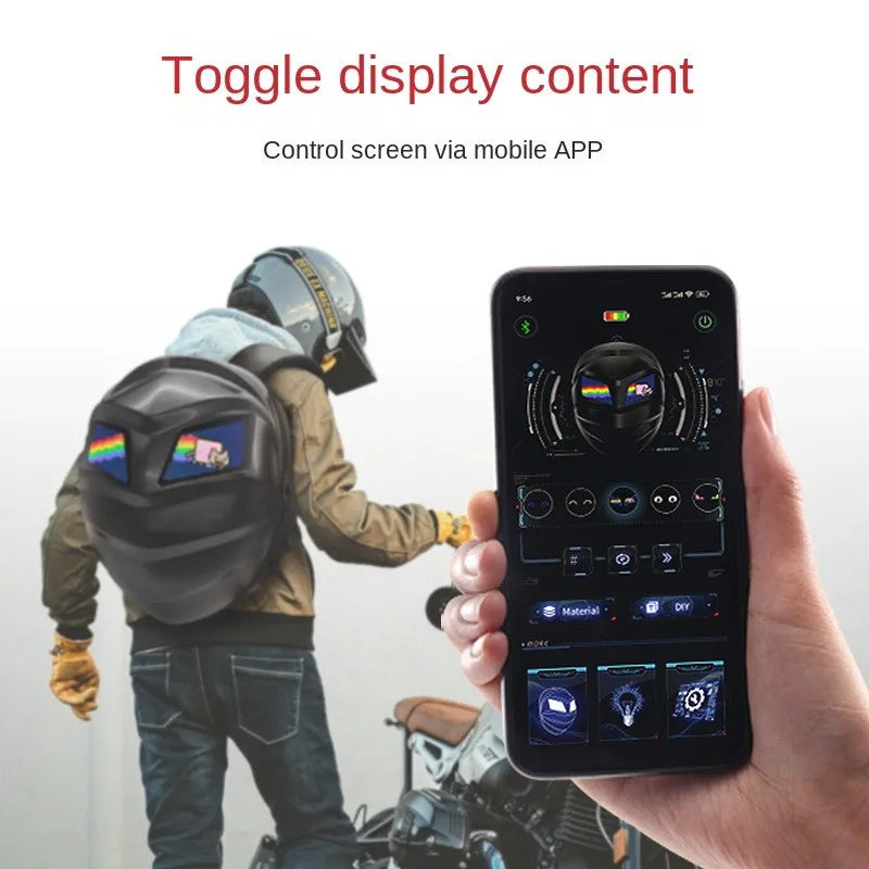 A person wearing a Moto & Biker style helmet and jacket uses a HeadphoneHeat LED Turtle Shell Backpack made from ABS material, featuring a screen displaying graphics. In their other hand, they hold a smartphone to control the display, with text reading, "Toggle display content via mobile APP.