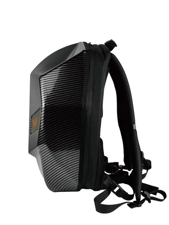 Side view of the HeadphoneHeat LED Hardshell Motorcycle Backpack, showcasing a fashion-forward design with a sleek black exterior and a durable textured shell similar to ABS. It includes adjustable straps, a top handle, and features a subtle emblem on the side.