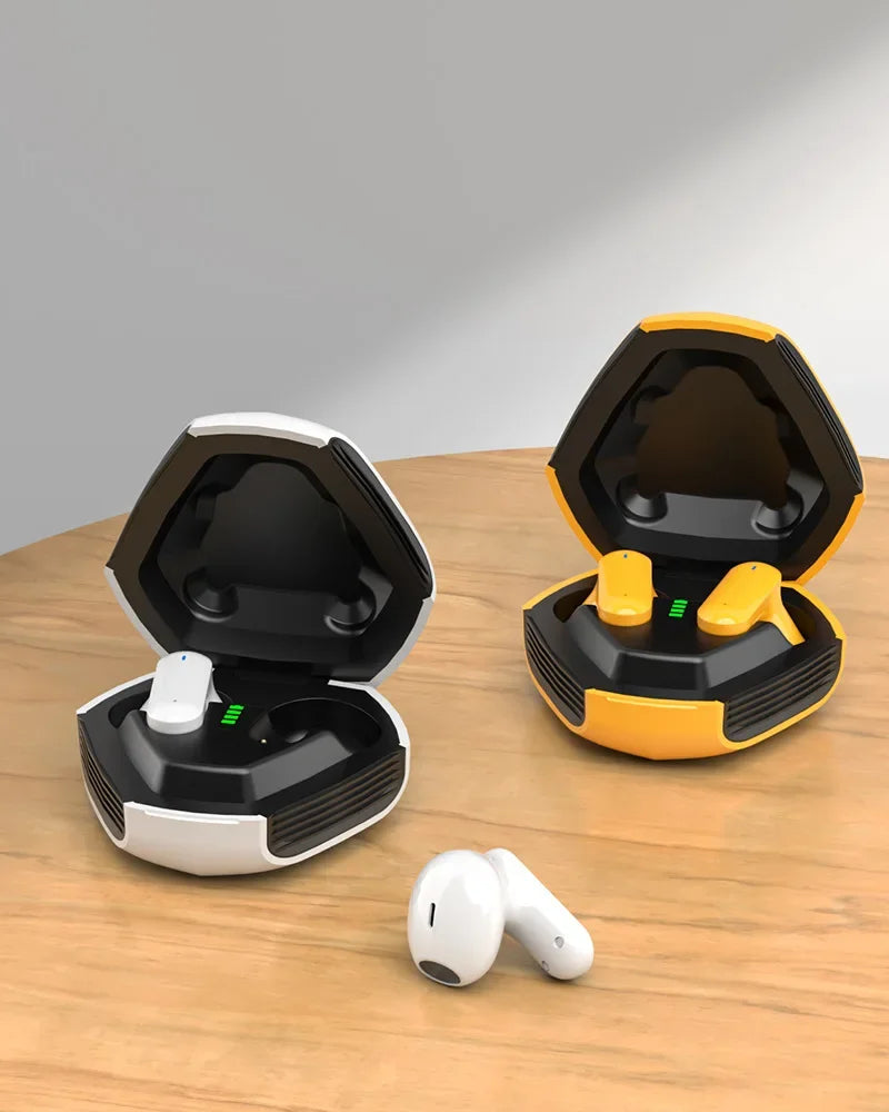 Two futuristic hexagonal Esports ZIXZEX Game Bluetooth TWS Earbud cases from HeadphoneHeat are displayed on a wooden table. The left case is white while the right one is yellow. Both cases are open, revealing the in-ear wireless headphones inside. Two white earbuds with active noise-cancellation are placed in front of the cases.