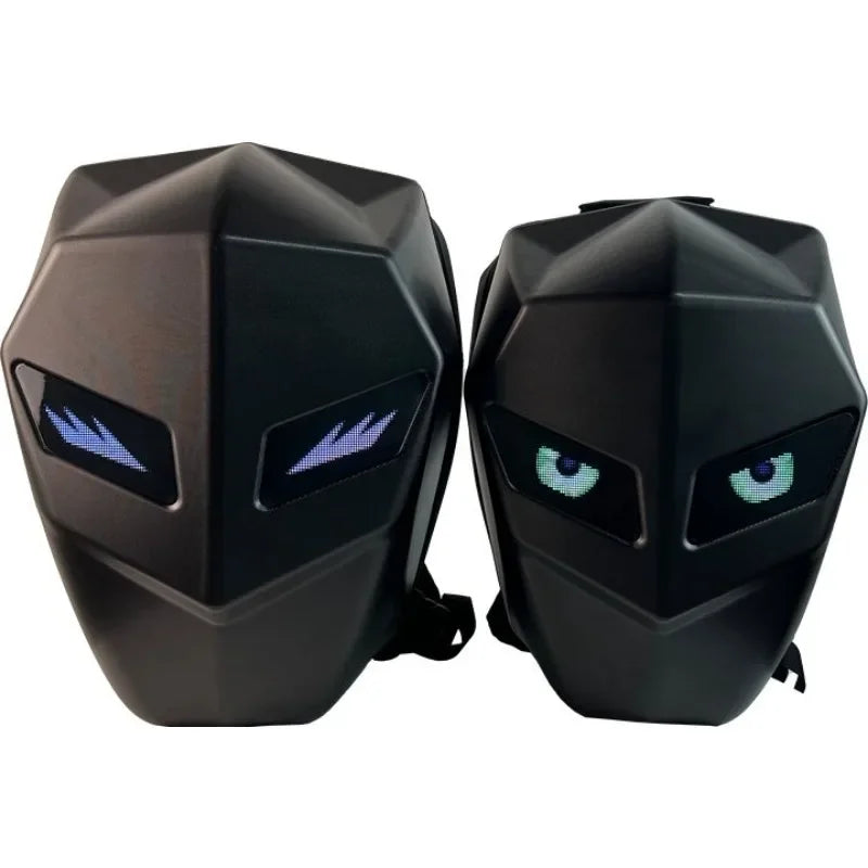 Introducing the LED Hardshell Motorcycle Backpack by HeadphoneHeat: A fashion-forward design in durable ABS, featuring futuristic black backpacks with angular forms and LED-lit eyes. One sports piercing blue eyes with a sharp gaze, while the other offers a cool, green-eyed neutral look.