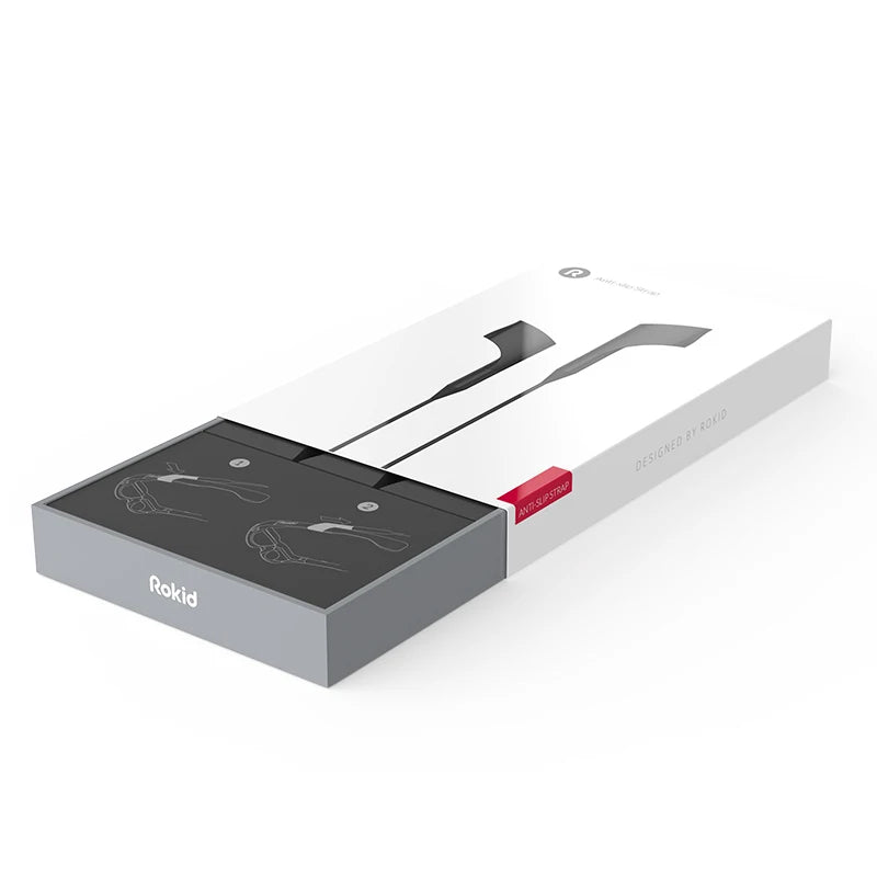 A sleek white and grey box with the "Rokid" logo partially open, revealing neatly packaged HeadphoneHeat Rokid Air Smart VR Glasses inside. The box features minimalist graphics and the text "Designed by Rokid" on the side.