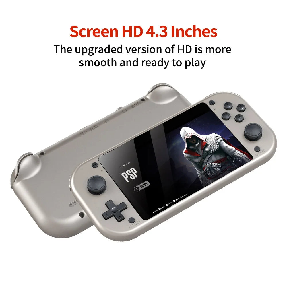 Two handheld gaming consoles are displayed. The front console, the HeadphoneHeat HRUEDA M17 Handheld Portable Game Console Linux PSP/N64, shows an Assassin's Creed game on its 4.3-inch HD screen, with buttons and joysticks on the sides. The back console reveals the device's rear side. Text above highlights the screen's smooth HD quality for classic game enthusiasts.