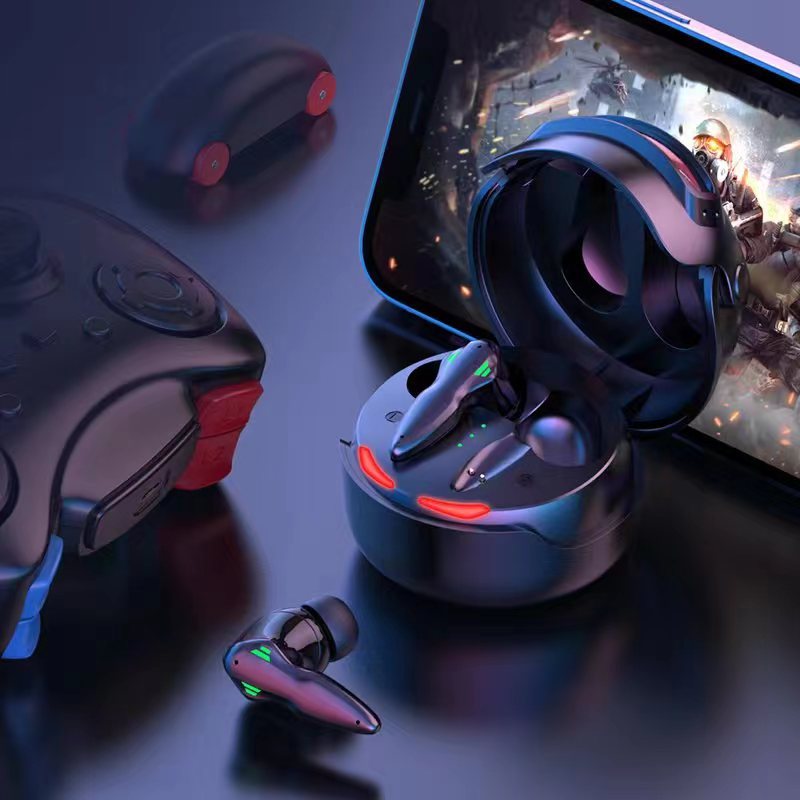 A gaming setup featuring HeadphoneHeat Fortipod Wireless Neutral Noise Cancellation Gaming Earbuds in a charging case, a smartphone displaying a sci-fi action game, and a game controller with red and blue accents. The scene is lit by ambient blue lighting, enhancing the futuristic and high-tech atmosphere.