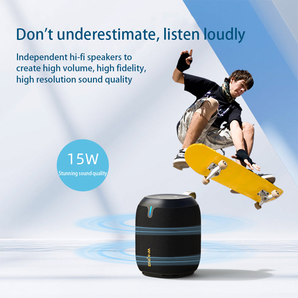 A person skateboarding of a black portable Bluetooth speaker 