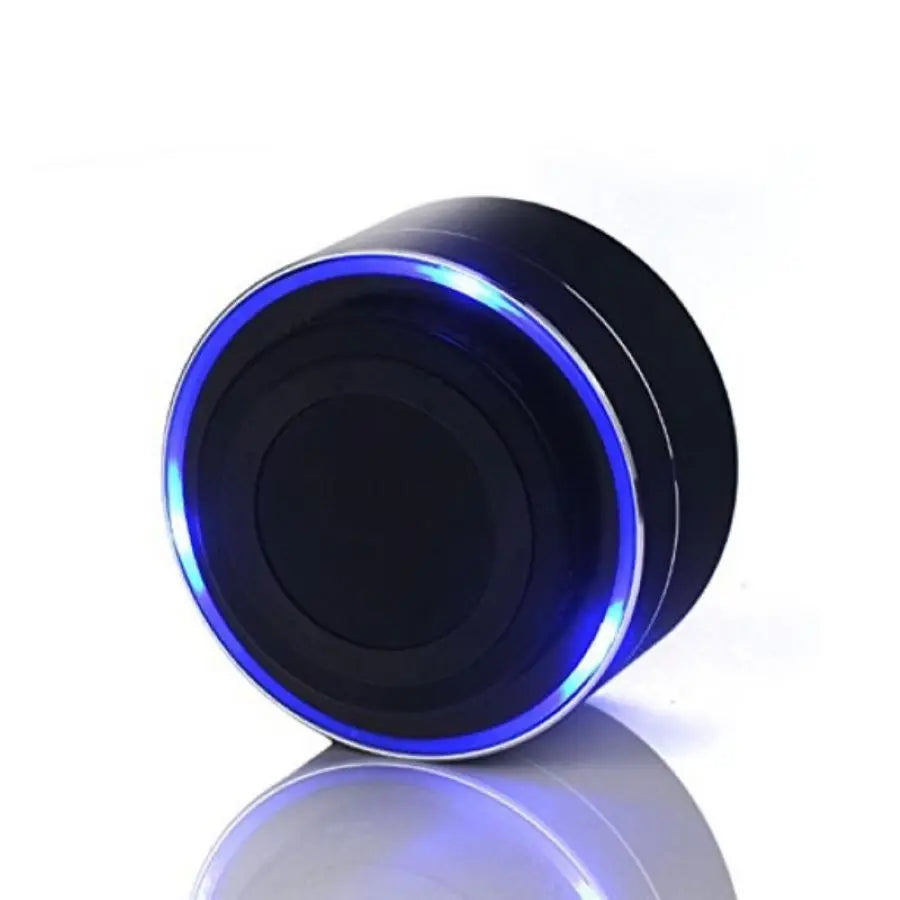 The Portable TOPK A10 Bluetooth Speaker by HeadphoneHeat.Com features a sleek black cylindrical design with a glowing blue LED ring on its reflective white surface. The LED encircles the top edge, giving it a futuristic look while delivering exceptional sound quality through its durable construction.